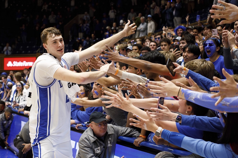 Duke's Cooper Flagg high-fives fans in likely final home game.