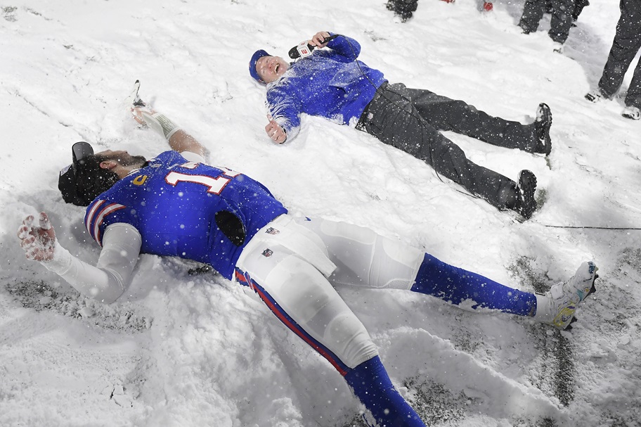 Josh Allen and Sean McDermott make snow angels after beating San Francisco.