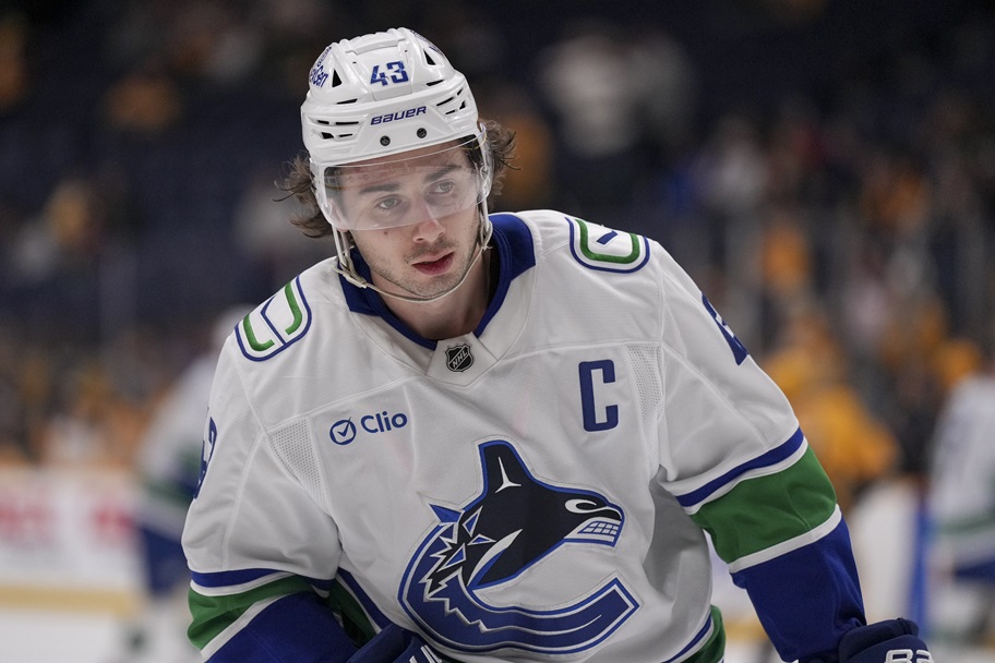 Vancouver's Quinn Hughes warms up for an NHL game.
