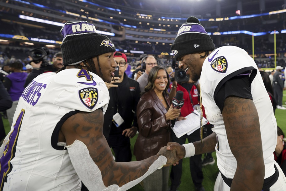 Baltimore's Zay Flowers and Lamar Jackson celebrate after a win.